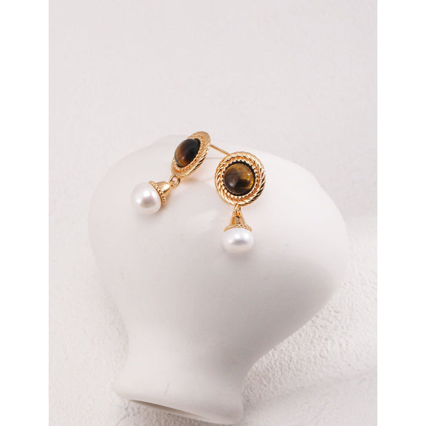 Gold drop earrings with tiger eye gemstones and pearl accents, perfect for vintage jewelry, jewelry storage, jewelry websites, and elegant jewelry for mom.
