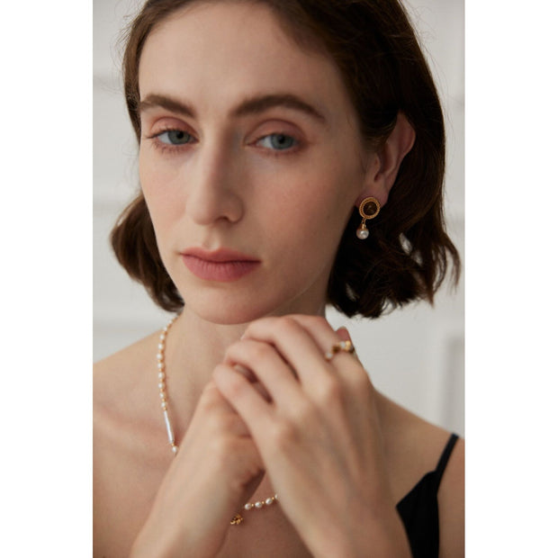 Gold drop earrings with tiger eye gemstones and pearl accents, perfect for vintage jewelry, jewelry storage, jewelry websites, and elegant jewelry for mom.