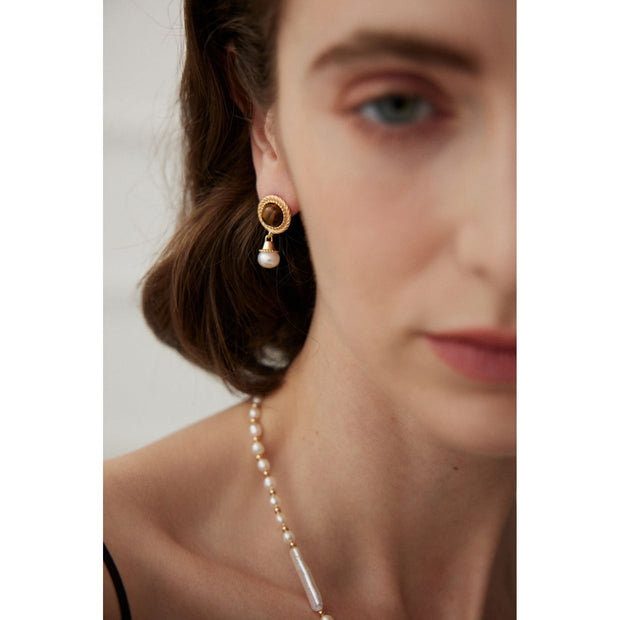 Gold drop earrings with tiger eye gemstones and pearl accents, perfect for vintage jewelry, jewelry storage, jewelry websites, and elegant jewelry for mom.