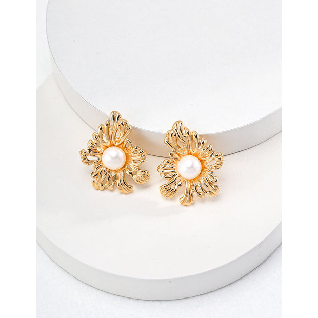 Vintage gold floral pearl earrings for jewelry storage and jewelry case lovers. Ideal for jewelry designers, earrings piercing, and fans of vintage jewelry styles.