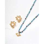 Vintage gold floral pearl earrings for jewelry storage and jewelry case lovers. Ideal for jewelry designers, earrings piercing, and fans of vintage jewelry styles.