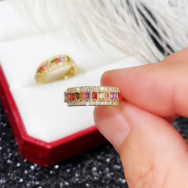 Gold hoop earrings with multicolored gemstones, perfect for jewelry websites, jewelry storage, vintage jewelry, and gifting for mom or jewelry lovers.