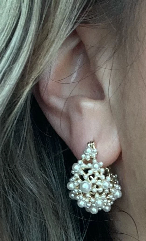 Gold hoop earrings adorned with cascading pearls, perfect for jewelry websites, jewelry storage, vintage jewelry, and gifting for mom or elegant occasions.