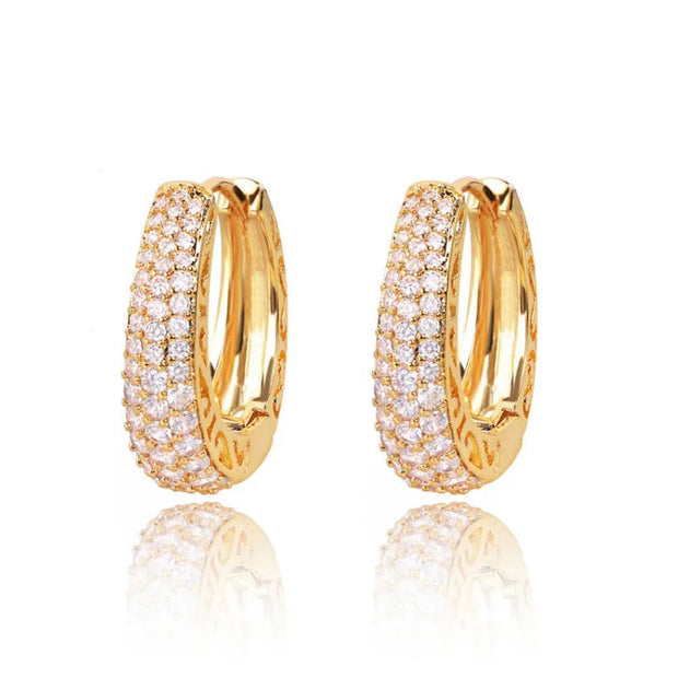 Gold hoop earrings with sparkling crystals and filigree design, perfect for jewelry websites, jewelry storage, vintage jewelry, and gifting for mom.