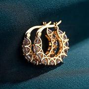 Gold hoop earrings with round-cut crystals, perfect for jewelry storage, jewelry websites, vintage jewelry, diamond and jewelry collections, and gifting.