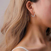 Gold hoop earrings with round-cut crystals, perfect for jewelry storage, jewelry websites, vintage jewelry, diamond and jewelry collections, and gifting.