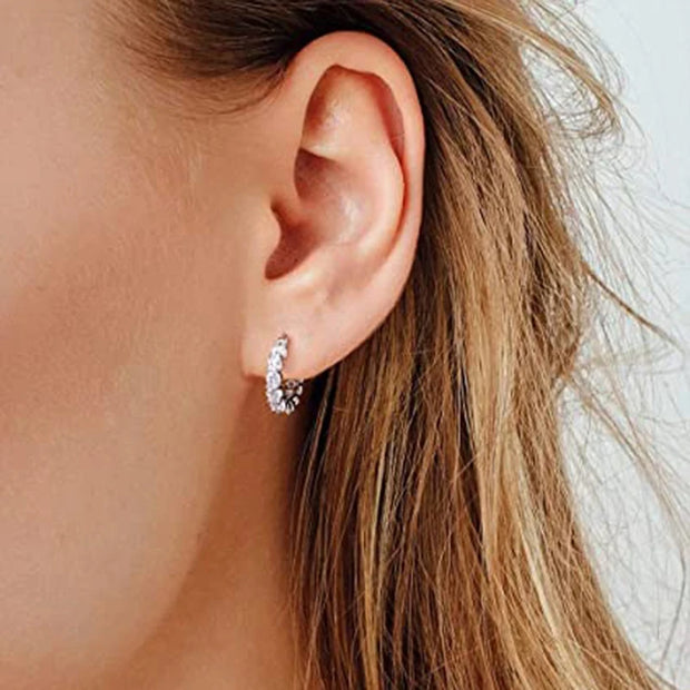 Gold hoop earrings with round-cut crystals, perfect for jewelry storage, jewelry websites, vintage jewelry, diamond and jewelry collections, and gifting.