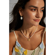 Gold leaf and pearl drop earrings perfect for jewelry storage, crafted by expert jewelry designers. Ideal for vintage jewelry lovers, earrings piercing, and unique jewelry brands.