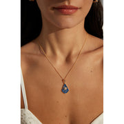 Gold necklace with blue enamel eye pendant and crystal accents, ideal for jewelry storage, crafted by top jewelry designers. Perfect for jewelry websites, vintage jewelry collections, jewelry for mom, and gem jewelry lovers. A standout accessory for body jewelry and jewelry with engraving.