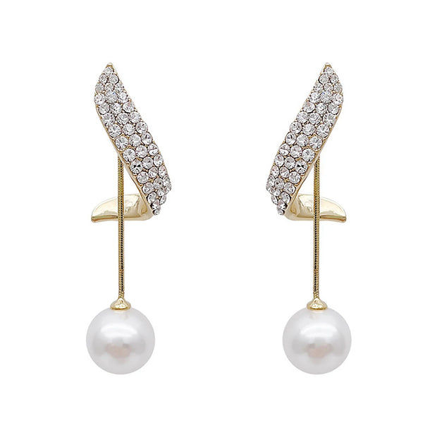 Gold pearl drop earrings with crystals by top jewelry designers, perfect for jewelry storage, vintage jewelry collections, and pairing with earrings rings or body jewelry.