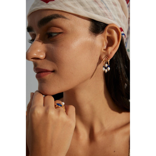 Elegant gold-tone earrings with pearls and navy beads, perfect for vintage jewelry enthusiasts, jewelry designers, and fans of earrings rings and piercing styles.