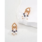 Elegant gold-tone earrings with pearls and navy beads, perfect for vintage jewelry enthusiasts, jewelry designers, and fans of earrings rings and piercing styles.