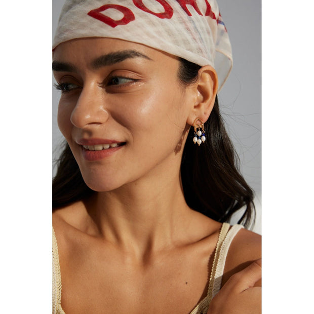 Elegant gold-tone earrings with pearls and navy beads, perfect for vintage jewelry enthusiasts, jewelry designers, and fans of earrings rings and piercing styles.