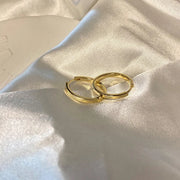 Gold hoop earrings with delicate pearls, ideal for jewelry storage, jewelry cleaning, and showcasing on jewelry websites by top jewelry designers for timeless style.