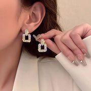 Gold hoop earrings with delicate pearls, ideal for jewelry storage, jewelry cleaning, and showcasing on jewelry websites by top jewelry designers for timeless style.