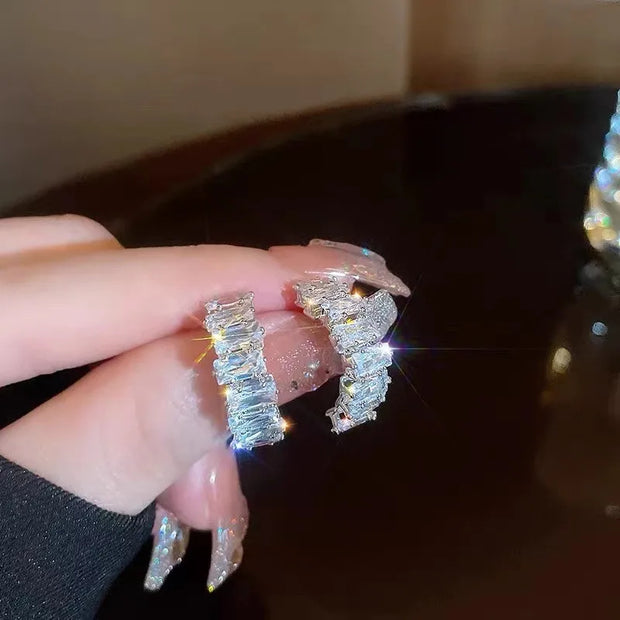 Gold hoop earrings with delicate pearls, ideal for jewelry storage, jewelry cleaning, and showcasing on jewelry websites by top jewelry designers for timeless style.