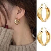 Gold hoop earrings with delicate pearls, ideal for jewelry storage, jewelry cleaning, and showcasing on jewelry websites by top jewelry designers for timeless style.