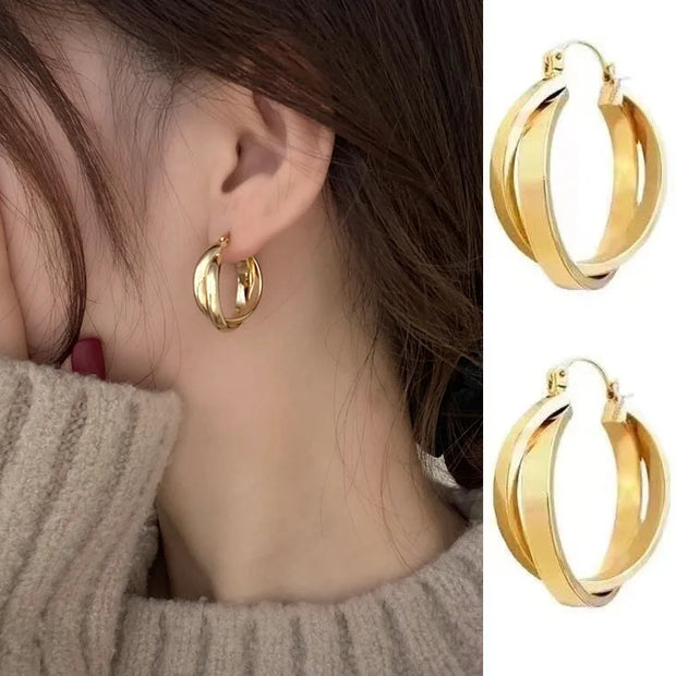 Gold hoop earrings with delicate pearls, ideal for jewelry storage, jewelry cleaning, and showcasing on jewelry websites by top jewelry designers for timeless style.
