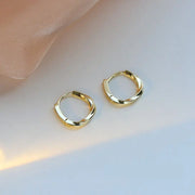 Gold hoop earrings with delicate pearls, ideal for jewelry storage, jewelry cleaning, and showcasing on jewelry websites by top jewelry designers for timeless style.