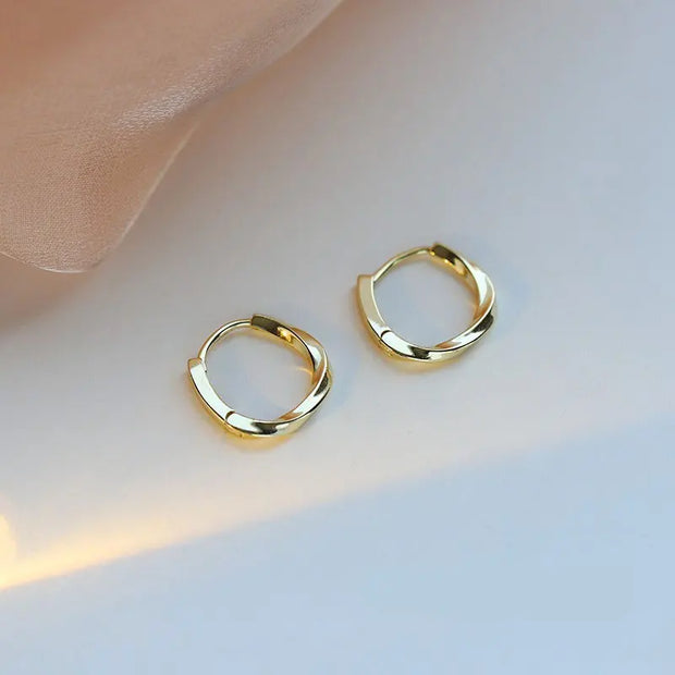 Gold hoop earrings with delicate pearls, ideal for jewelry storage, jewelry cleaning, and showcasing on jewelry websites by top jewelry designers for timeless style.