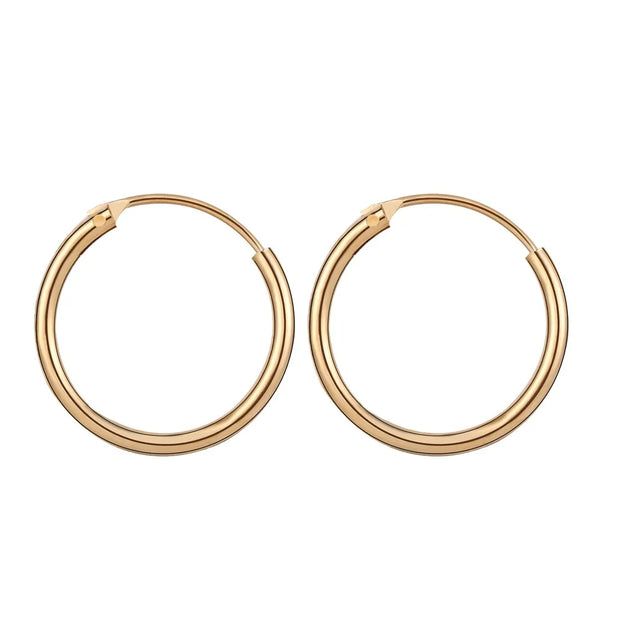 Gold hoop earrings with delicate pearls, ideal for jewelry storage, jewelry cleaning, and showcasing on jewelry websites by top jewelry designers for timeless style.