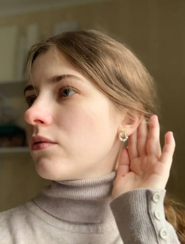 Gold hoop earrings with delicate pearls, ideal for jewelry storage, jewelry cleaning, and showcasing on jewelry websites by top jewelry designers for timeless style.