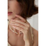 Gold and silver cuff rings with intricate detailing on a white surface, perfect for vintage jewelry collectors, jewelry designers, and jewelry websites. Ideal for jewelry storage, jewelry cases, and pairing with earrings rings or gem jewelry styles. A must-have for those seeking jewelry cleaning tips or diamond and jewelry care.