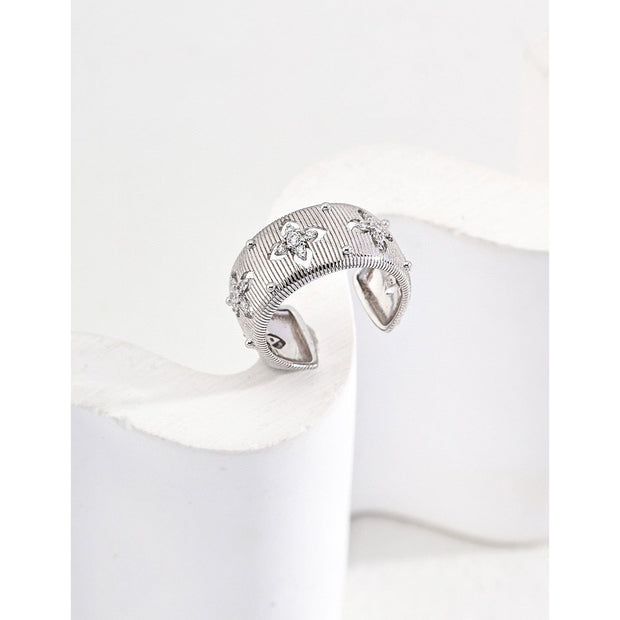 Gold and silver cuff rings with intricate detailing on a white surface, perfect for vintage jewelry collectors, jewelry designers, and jewelry websites. Ideal for jewelry storage, jewelry cases, and pairing with earrings rings or gem jewelry styles. A must-have for those seeking jewelry cleaning tips or diamond and jewelry care.