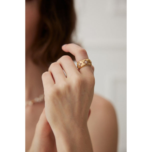 Gold and silver cuff rings with intricate detailing on a white surface, perfect for vintage jewelry collectors, jewelry designers, and jewelry websites. Ideal for jewelry storage, jewelry cases, and pairing with earrings rings or gem jewelry styles. A must-have for those seeking jewelry cleaning tips or diamond and jewelry care.