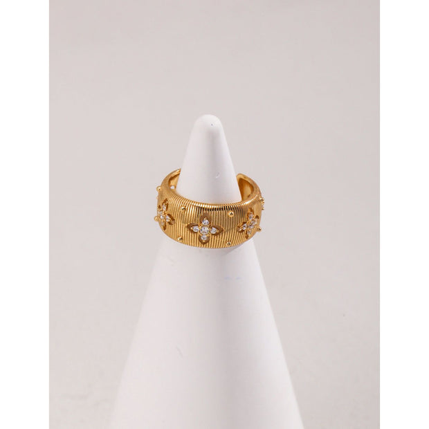 Gold and silver cuff rings with intricate detailing on a white surface, perfect for vintage jewelry collectors, jewelry designers, and jewelry websites. Ideal for jewelry storage, jewelry cases, and pairing with earrings rings or gem jewelry styles. A must-have for those seeking jewelry cleaning tips or diamond and jewelry care.