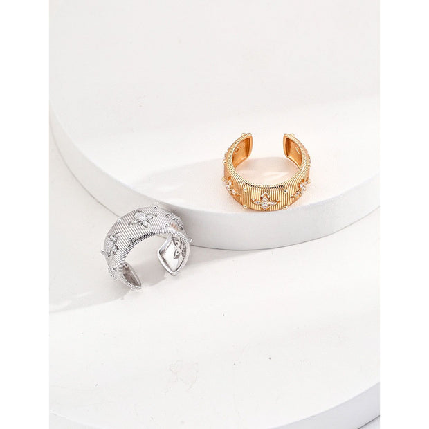 Gold and silver cuff rings with intricate detailing on a white surface, perfect for vintage jewelry collectors, jewelry designers, and jewelry websites. Ideal for jewelry storage, jewelry cases, and pairing with earrings rings or gem jewelry styles. A must-have for those seeking jewelry cleaning tips or diamond and jewelry care.