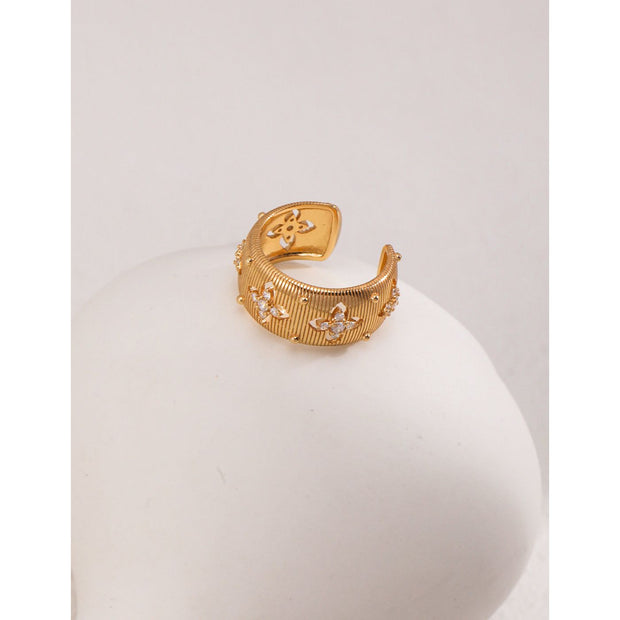 Gold and silver cuff rings with intricate detailing on a white surface, perfect for vintage jewelry collectors, jewelry designers, and jewelry websites. Ideal for jewelry storage, jewelry cases, and pairing with earrings rings or gem jewelry styles. A must-have for those seeking jewelry cleaning tips or diamond and jewelry care.