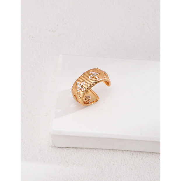 Gold and silver cuff rings with intricate detailing on a white surface, perfect for vintage jewelry collectors, jewelry designers, and jewelry websites. Ideal for jewelry storage, jewelry cases, and pairing with earrings rings or gem jewelry styles. A must-have for those seeking jewelry cleaning tips or diamond and jewelry care.