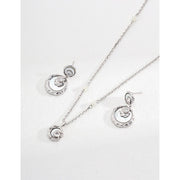 Gold and silver drop earrings with crystal accents, ideal for jewelry designers, jewelry websites, and jewelry storage. Perfect for vintage jewelry lovers, earrings rings combinations, and pairing with mature women hairstyles. A must-have for gem jewelry collections and diamond and jewelry enthusiasts.