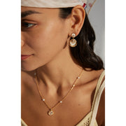 Gold and silver drop earrings with crystal accents, ideal for jewelry designers, jewelry websites, and jewelry storage. Perfect for vintage jewelry lovers, earrings rings combinations, and pairing with mature women hairstyles. A must-have for gem jewelry collections and diamond and jewelry enthusiasts.