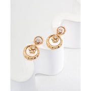 Gold and silver drop earrings with crystal accents, ideal for jewelry designers, jewelry websites, and jewelry storage. Perfect for vintage jewelry lovers, earrings rings combinations, and pairing with mature women hairstyles. A must-have for gem jewelry collections and diamond and jewelry enthusiasts.