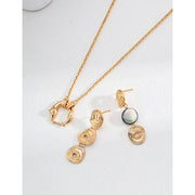 Elegant gold and silver swirl drop earrings with abalone accents, perfect for jewelry storage, designed by top jewelry designers, ideal for earrings piercing or gifting. Great addition to vintage jewelry collections, suitable for body jewelry, jewelry for mom, and jewelry with turquoise or engraving.