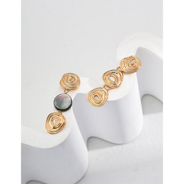 Elegant gold and silver swirl drop earrings with abalone accents, perfect for jewelry storage, designed by top jewelry designers, ideal for earrings piercing or gifting. Great addition to vintage jewelry collections, suitable for body jewelry, jewelry for mom, and jewelry with turquoise or engraving.