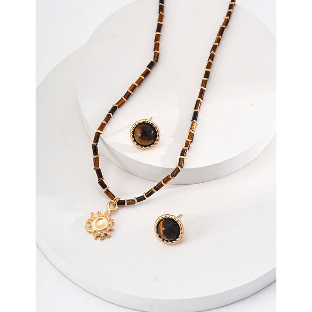 Boho sun pendant necklace with gold and beaded chain, perfect for jewelry websites, jewelry designers, jewelry storage, and vintage jewelry collections.
