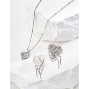 Gold and silver heart pendant necklaces with textured designs, perfect for jewelry storage, jewelry websites, vintage jewelry collections, and thoughtful gifting.