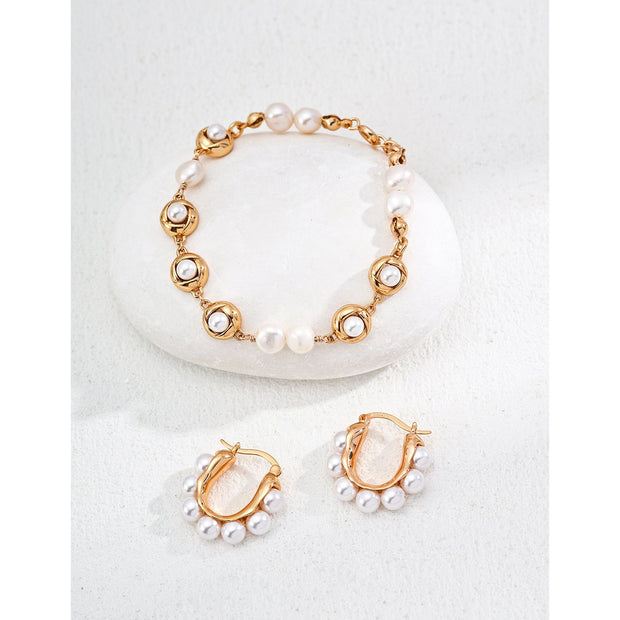 Gold and silver hoop earrings with pearl accents, ideal for jewelry storage, jewelry websites, vintage jewelry collections, and stylish everyday accessories.