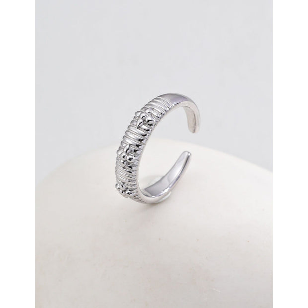 Gold and silver adjustable open rings with geometric detailing, ideal for jewelry storage, jewelry websites, gem jewelry collections, and modern, elegant gifting.