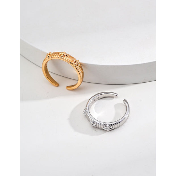 Gold and silver adjustable open rings with geometric detailing, ideal for jewelry storage, jewelry websites, gem jewelry collections, and modern, elegant gifting.