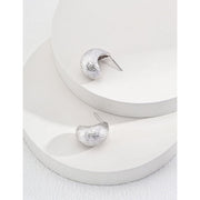 Gold and silver textured hoop earrings, perfect for jewelry storage, jewelry websites, vintage jewelry collections, and stylish accessories for all occasions.