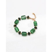 Green resin stone bracelet with gold accents, perfect for vintage jewelry lovers. Designed by expert jewelry designers, ideal for jewelry storage, jewelry websites, and jewelry cases. A great gift option for jewelry for mom or fans of gem jewelry and turquoise jewelry. Suitable for permanent jewelry collections or body jewelry.