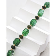 Green resin stone bracelet with gold accents, perfect for vintage jewelry lovers. Designed by expert jewelry designers, ideal for jewelry storage, jewelry websites, and jewelry cases. A great gift option for jewelry for mom or fans of gem jewelry and turquoise jewelry. Suitable for permanent jewelry collections or body jewelry.