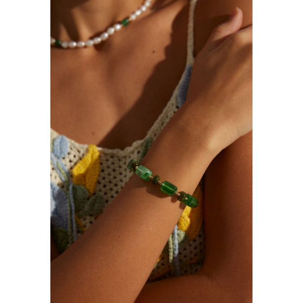 Green resin stone bracelet with gold accents, perfect for vintage jewelry lovers. Designed by expert jewelry designers, ideal for jewelry storage, jewelry websites, and jewelry cases. A great gift option for jewelry for mom or fans of gem jewelry and turquoise jewelry. Suitable for permanent jewelry collections or body jewelry.