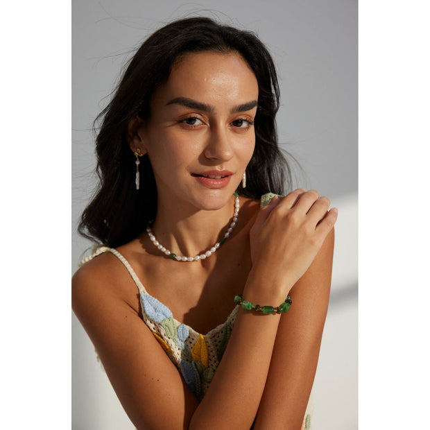 Green resin stone bracelet with gold accents, perfect for vintage jewelry lovers. Designed by expert jewelry designers, ideal for jewelry storage, jewelry websites, and jewelry cases. A great gift option for jewelry for mom or fans of gem jewelry and turquoise jewelry. Suitable for permanent jewelry collections or body jewelry.