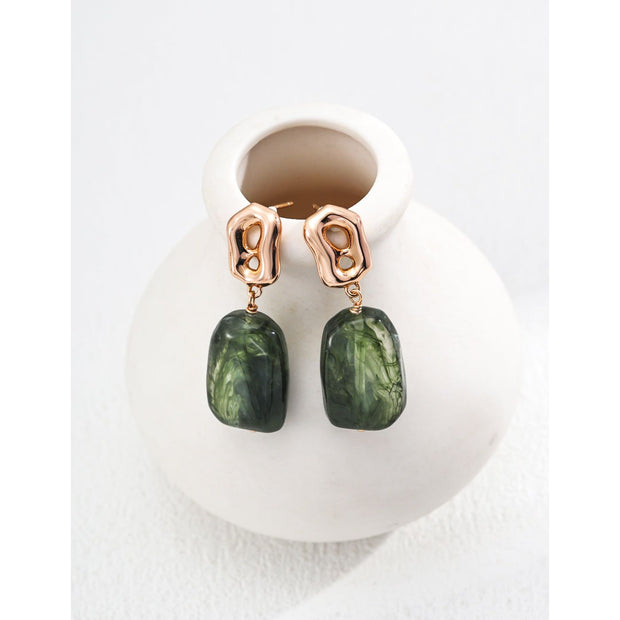 Green stone drop earrings with gold accents, perfect for jewelry storage, jewelry websites, vintage jewelry collections, and as bold, stylish accessories.