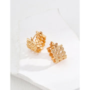 Gold filigree hoop earrings with intricate design, ideal for jewelry storage, jewelry websites, vintage jewelry collections, and sophisticated fashion looks.